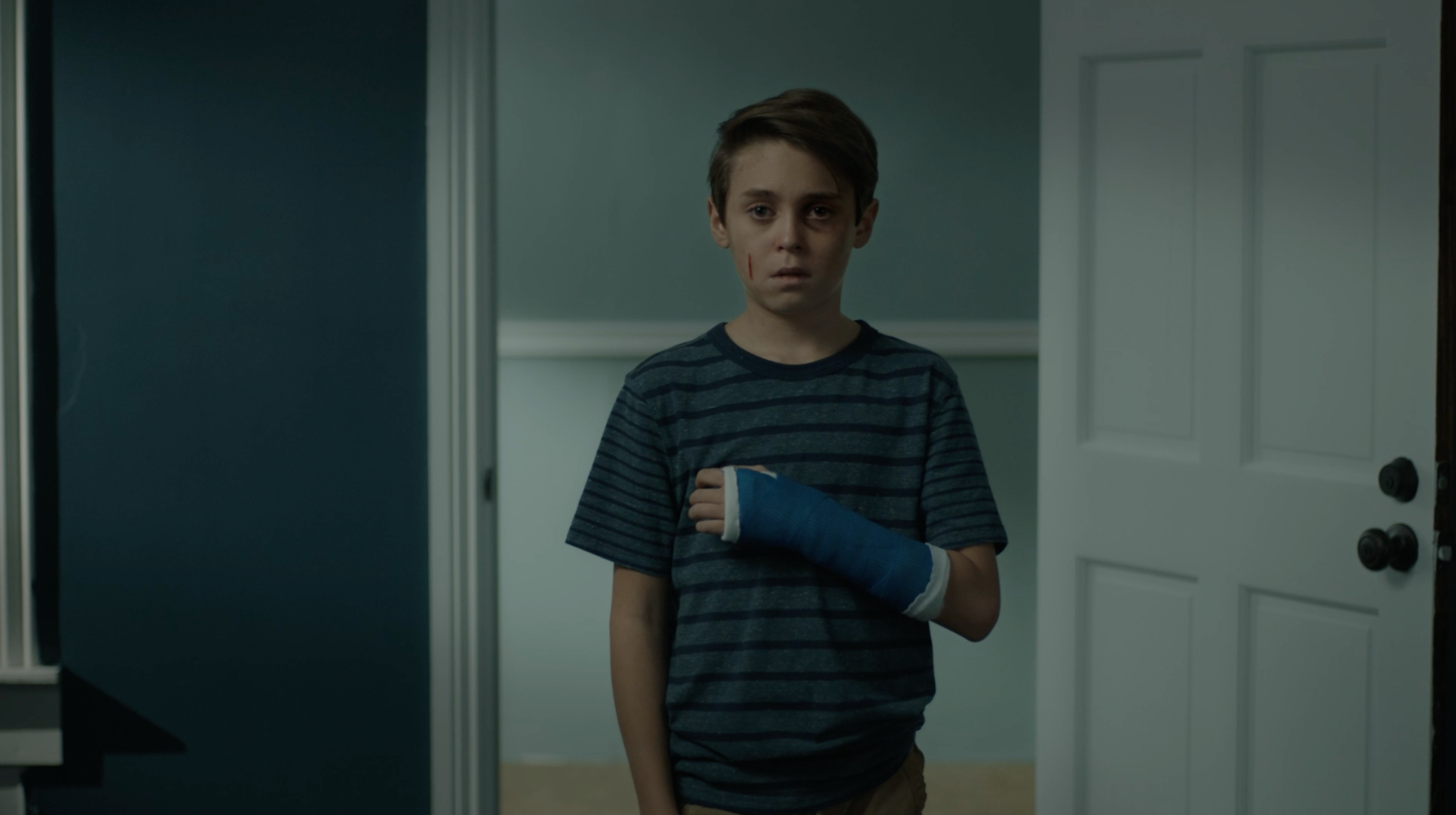Campaign film poster showing a child with his arm in a cast