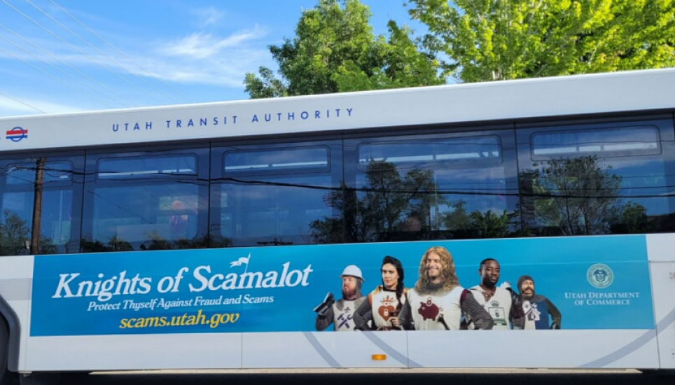 Knights of Scamalot campaign on the side of a Utah bus