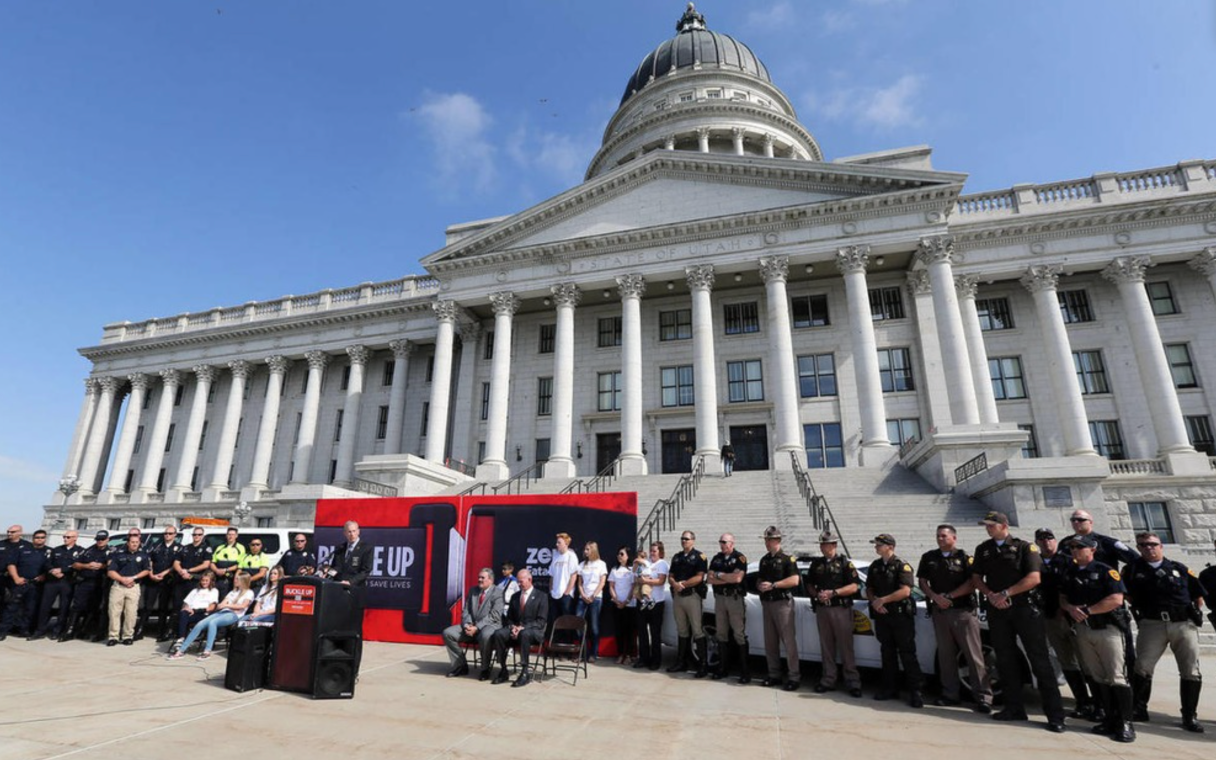 Law enforcement officers and officials gathered on the Utah State Capitol steps