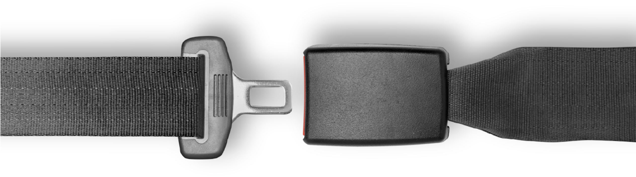 An unbuckled seat belt with its latch and buckle pulled apart